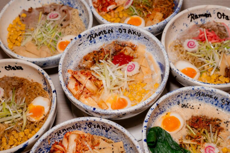 A vibrant assortment of Japanese ramen bowls with flavorful toppings.